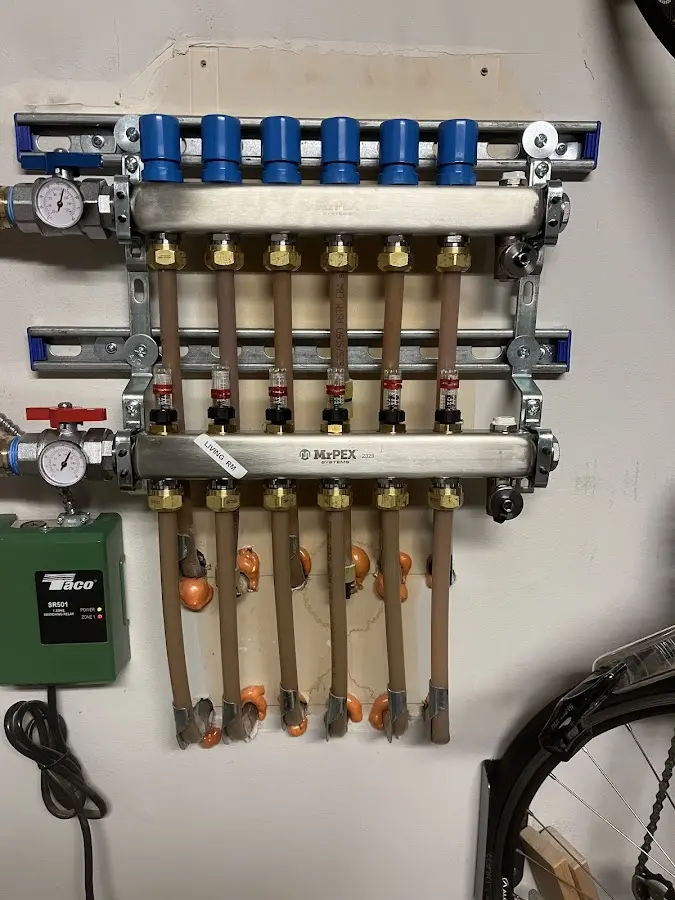 Plumber performing Water Heater Repair at a residential property in Merrimack